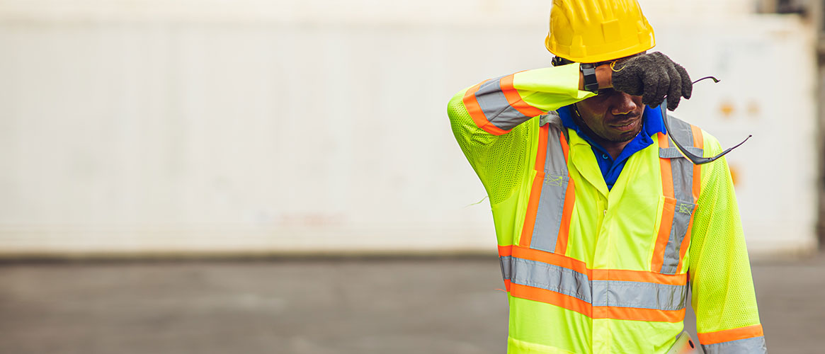 Port worker sweating from hot weather in summer
