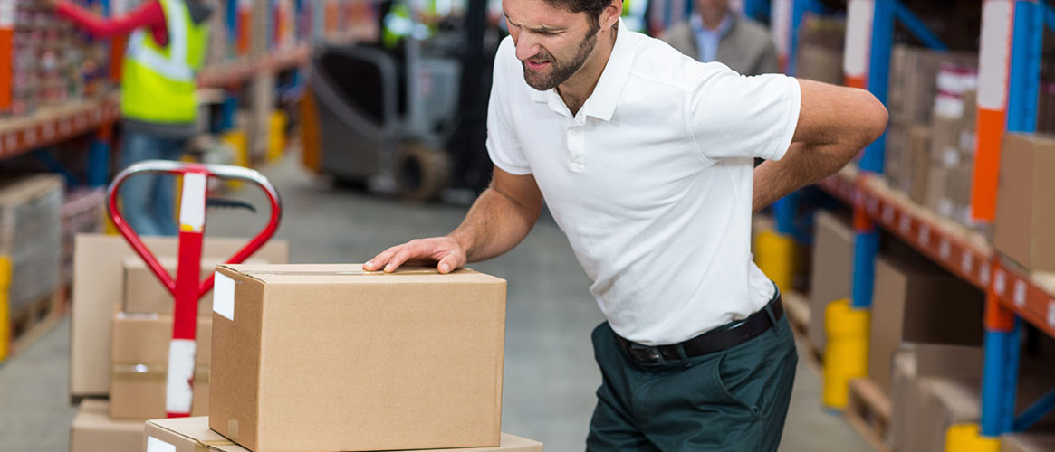 man with backache in warehouse