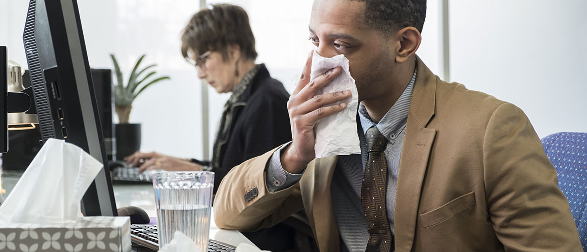 person covering their mouth and nose