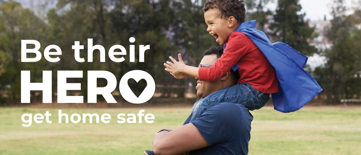 Be their hero. Get home safe. Healthy dad carrying son in hero cape on shoulders Be their hero. Get home safe. Healthy dad carrying son in hero cape on shoulders
